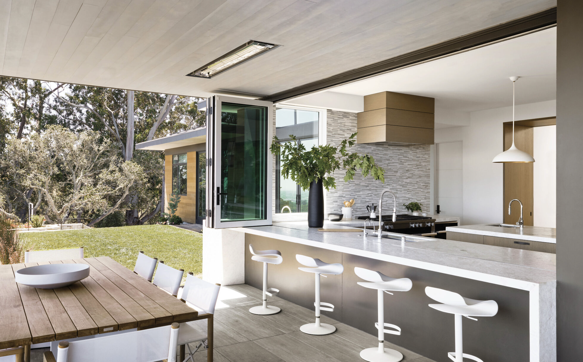 indoor outdoor transitional kitchen island bench connected spaces